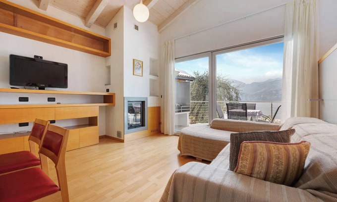 Magugnago Apartamento | Apartamento vacacional "Casa-Lago Suite" con vistas al lago, piscina compartida y Wi-Fi