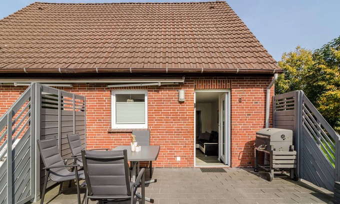 Wangerland Apartamento | Apartamento vacacional 'Nordsee' con terraza compartida, jardín compartido y Wi-Fi
