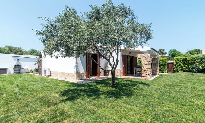 Porto San Paolo Casa | Casa de vacaciones "Villa Teresa" con piscina compartida, terraza privada y aire acondicionado