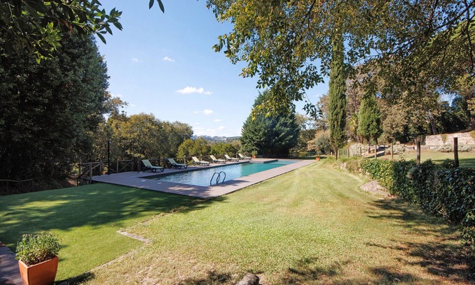 Beijos Casa | Casa de vacaciones 'Casa De Andrães Camélias' con piscina compartida, Wi-Fi y aire acondicionado
