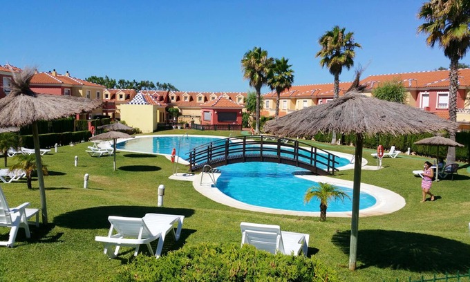 Islantilla Apartamento | Homerez - Apt in Islantilla, pool.