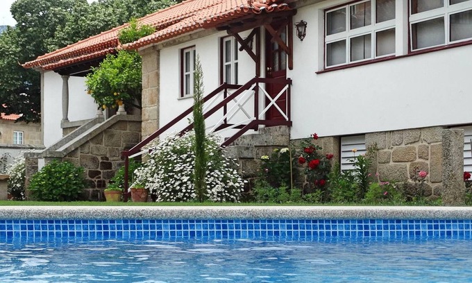 Fatauncos Casa | Homerez - Casa para 8 pers. con piscina compartida, jardín y terraza en Vouzela