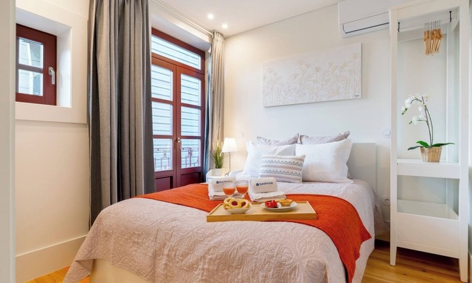 Guimaraes Apartamento | HostWise - Bright and Cozy Flat w/ Balcony