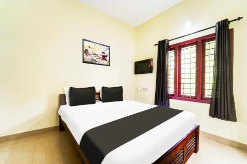 Kumbalam Hotel | Hotel O Nettoor Near Lakeshore Hospital