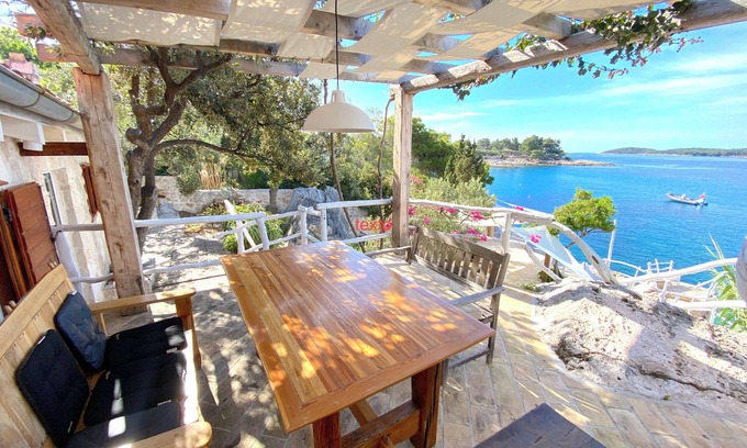 Hvar Casa | house for two with a private terrace located directly on the beach, town Hvar