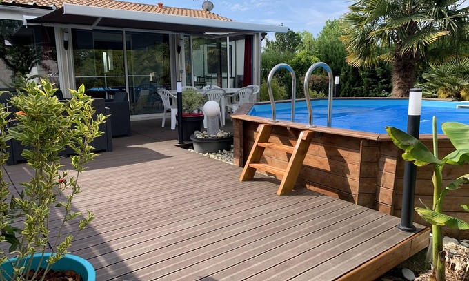 Saint Laurent de la Pree Casa | House with large veranda terrace and above-ground pool