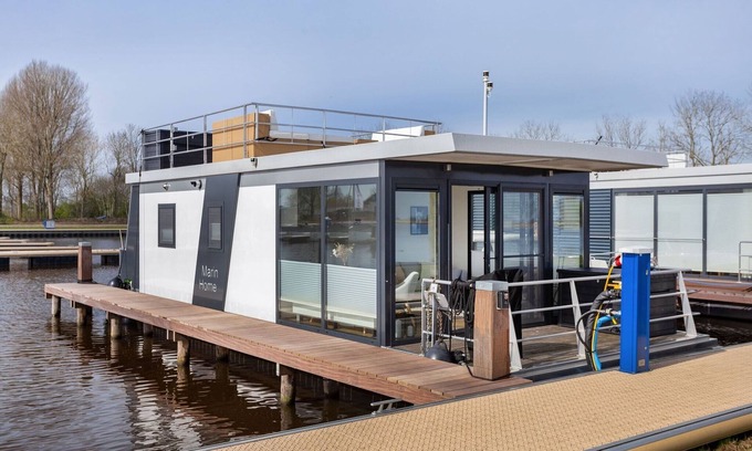 Offingawier Alquiler De Eote | Casa flotante Sneekermeer con jardín y vistas