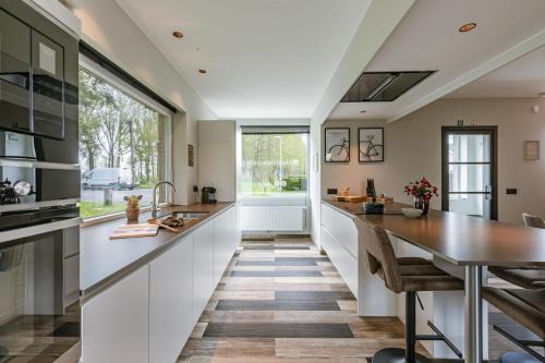 Moerkerke Casa | Huswell - Holiday home along the canal with great views