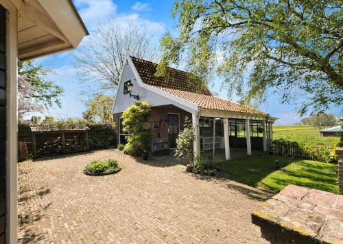 Oterleek Casa | Idyllisch en knus huisje met prachtige veranda.