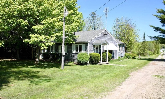 Lake Leelanau Cabaña | In the narrows on Lake Leelanau, pet friendly, sleeps 8, and a dock!