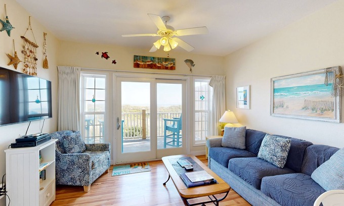 Hatteras Condominio | Inviting beachfront condo featuring hot tub & pool, central AC, elevator, & deck