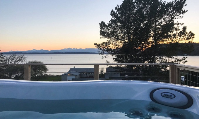 Clinton Casa | Inviting Puget Sound view home with beach access, fire table, hot tub, & W/D