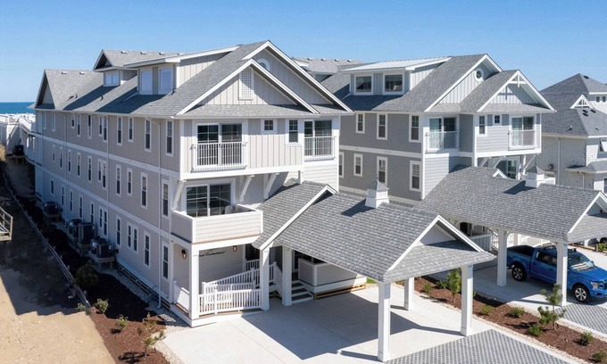 Kill Devil Hills Casa | Island Enchantment - Oceanfront Pet Friendly Home w/ Cabana Service! FlexStay! Incredible Views, Poolside Tiki Bar, Hot Tub, and More!