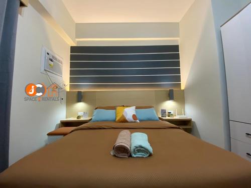 Mactan Export Processing Zone Apartamento | JC SpaceRentals 127B Amani Grand Resort Residences, balcony pool view, Ground floor, 5 mins frm airport, free wifi, Netflix