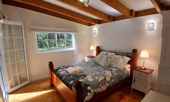 Springbrook Casa | Cosy Romantic Rainforest Luxury Cottage in Springbrook-waterfalls, fireplace