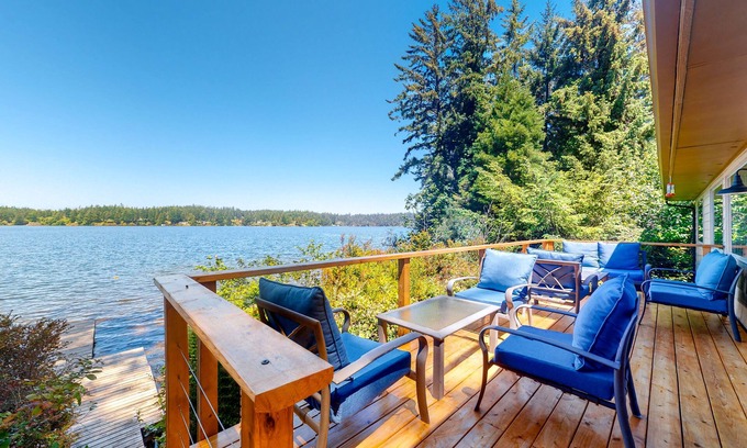 Dunes City Casa | Lakefront dream with private hot tub, dock, kayaks, pedal boat & amazing views