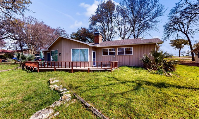 Kemp Casa | Lakefront retreat near golf course with serene wraparound deck, fireplace, & AC