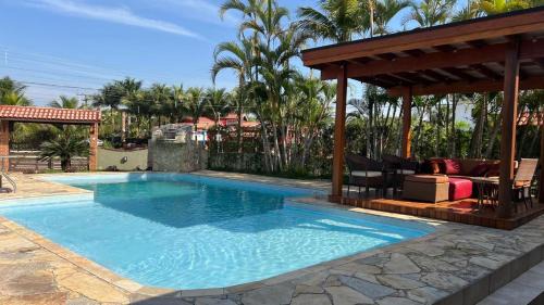 Morada da Praia Casa | Linda casa com piscina privativa Morada da Praia 3 quartos e 4 banheiros Aceita Pet Wi-fi na casa toda Área gourmet com churrasqueira acomoda até 15 pessoas com muito conforto 2 bicicletas disponíveis para um passeio pelo condomíno