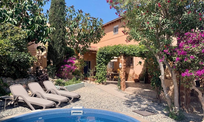 Los Vives Casa | Loma Alta; a unique 19th century cave house with lush garden and private pool
