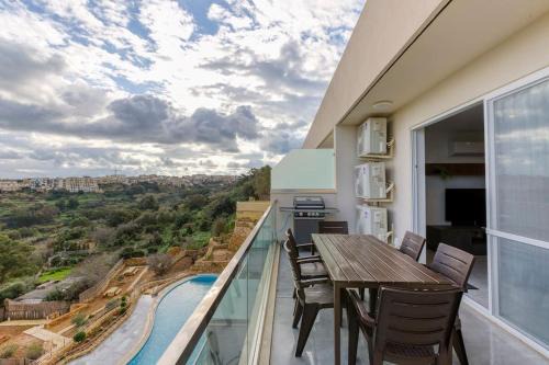 Xaghra Apartamento | Lovely home with beautiful view with communal pool by 360 Estates