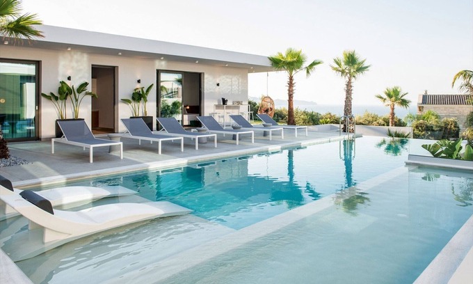 Kissamos Villa | Luxury Crete Villa | Villa Silver | 6 Bedrooms | Private Outdoor Infinity Pool & Indoor Heated Pool | Outdoor Lounge Area & Fireplace & BBQ | Wonderful Sea Views | Modern Design | Chania
