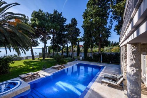 Split Villa | Luxury Seafront Villa Castello Split with private heated pool, jacuzzi and sauna at the beach in Split