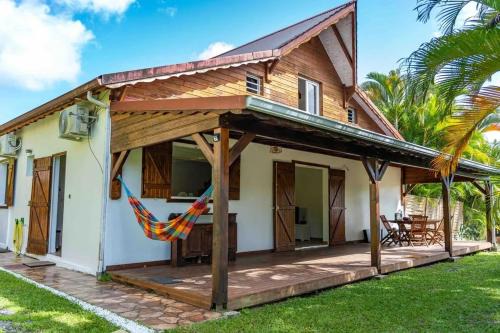 Point d'Or Casa | Maison chaleureuse aux Abymes avec jacuzzi relaxant