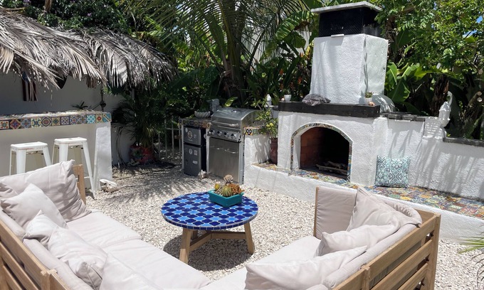 Bajo Casa | Malecon Beach House with beautiful backyard. Steps from the Caribbean ocean.