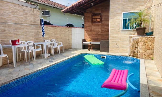 Real Casa | Modern and cozy house with fireplace and heated pool just 50m from the beach