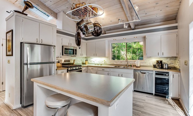 Anchor Bay Casa | Modern, Dog-Friendly Retreat with a Private Deck, Hot Tub, Fireplace, & Sun Room