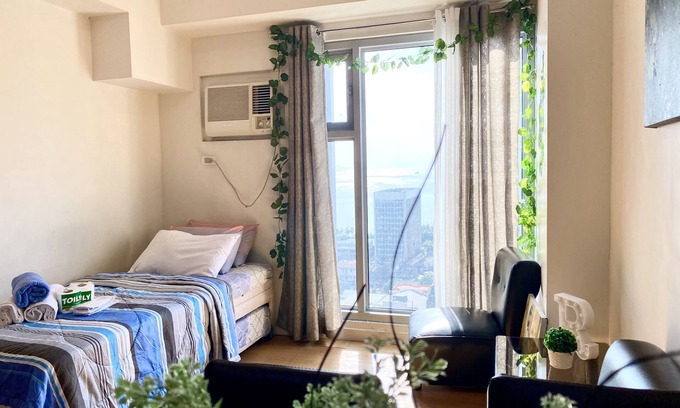 Barangay 670 Condominio | Condominio estudio moderno con puesta de sol con vista a la bahía de Manila
