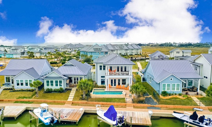 Rockport Casa | Modern, waterfront home with private pool, dock, balconies, central AC, and WiFi
