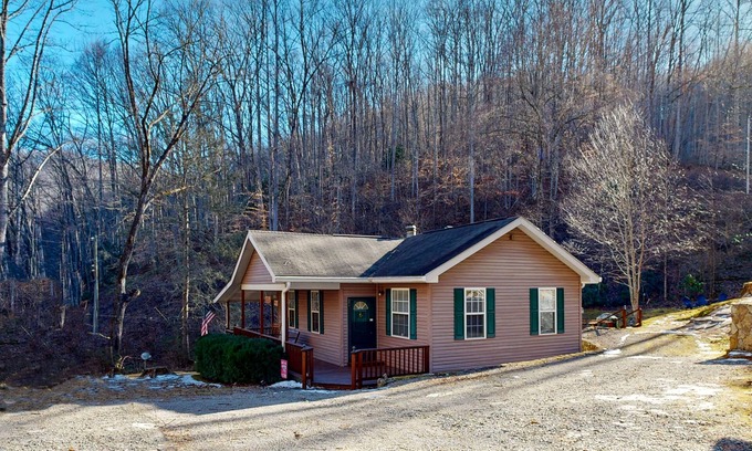 Sylva Casa | Mountain view home with a fireplace with beautiful view of the creek