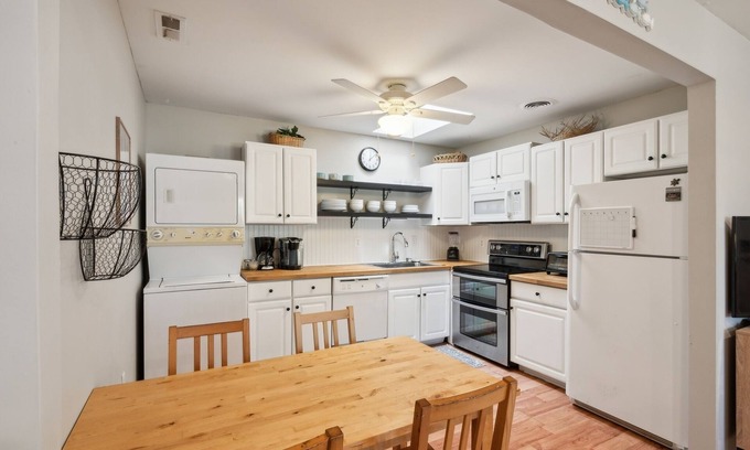 Village Green Condominio | NEW LISTING! Cozy 2BR Condo - Beachside Bliss with Yard Space