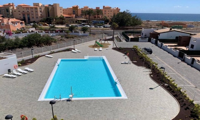 Caleta de Fuste Apartamento | Ático nuevo con vistas al mar y al campo de golf