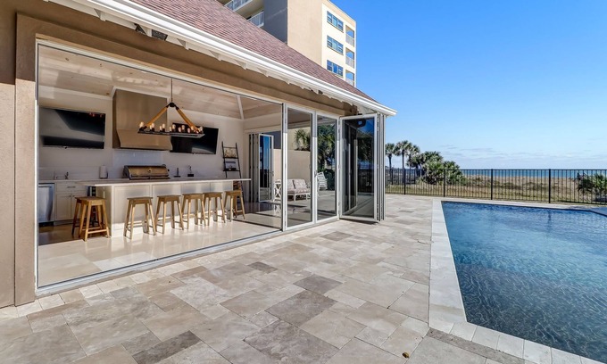 Fernandina Beach Casa | Oceanfront | Luxury Beachfront Home | Wall to Wall Folding Glass Doors Opening to Private Pool Deck