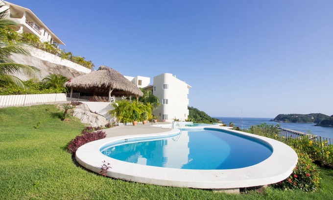 P Chahue Condominio | Lujo frente al mar con vistas a la bahía y al puerto deportivo