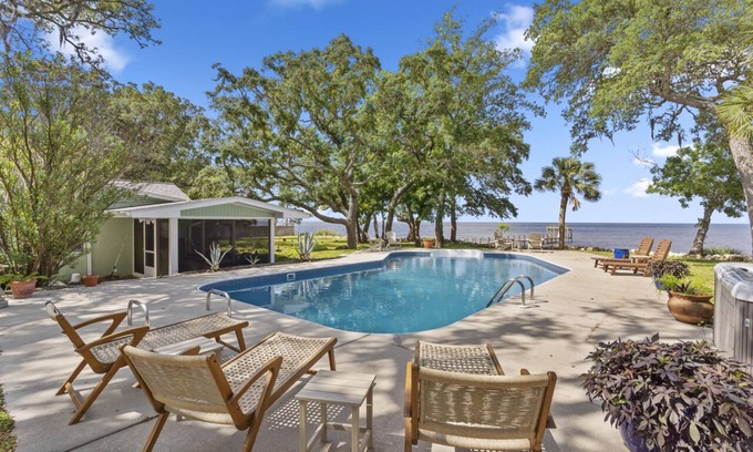 Magnolia Bluffs Casa | "PARADISE ON THE BAY!" Private Pool, Dock & Hot Tub!! Just 10 min to SGI