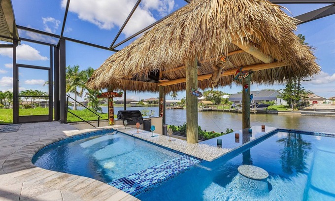 Burnt Store Casa | Paradise Tiki: Gulf Access, Tiki Bar, Pool & Spa! Spacious 5 bedroom home!