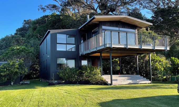 Matapouri Casa | Peaceful 4-Bedroom Beach House across road from estuary & fantastic beach views