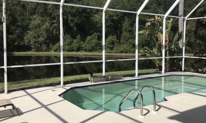 Coventry Village Casa | Perfectly placed by-beach & city 4 bd 2.5 b pool w pond & preserve view