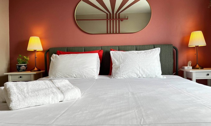 Downtown Apartamento | Pink Sunrise: Energetic Studio, Bold Decor