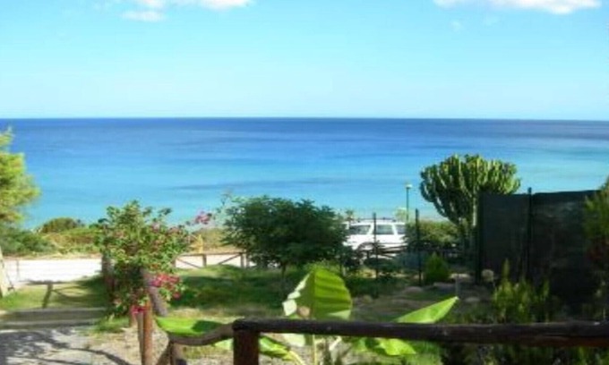 Santa Margherita di Pula Apartamento | Pinus Village caposchiera con terraza con vistas al mar