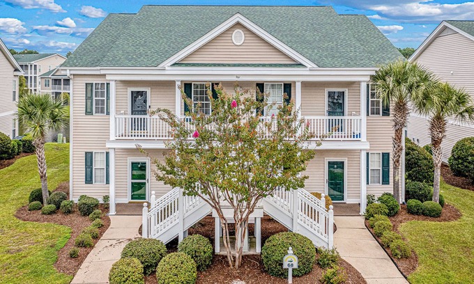 Sunset Beach Condominio | Pond-front condo near beach with balcony, pool, & hot tub - snowbird-friendly