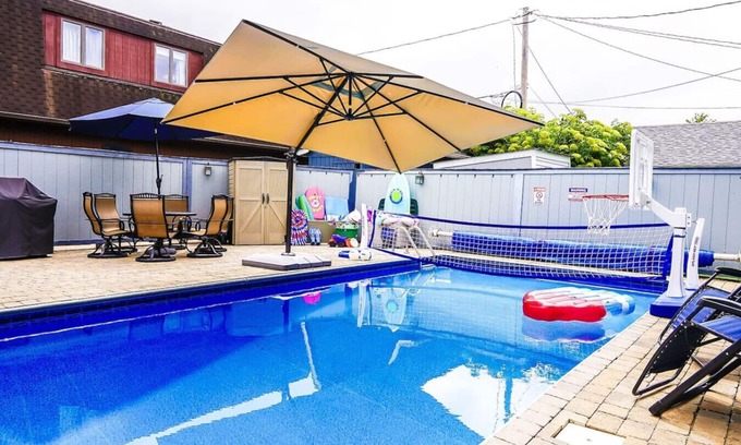 Huron Casa | Private heated pool in back & Sandy beach in front
