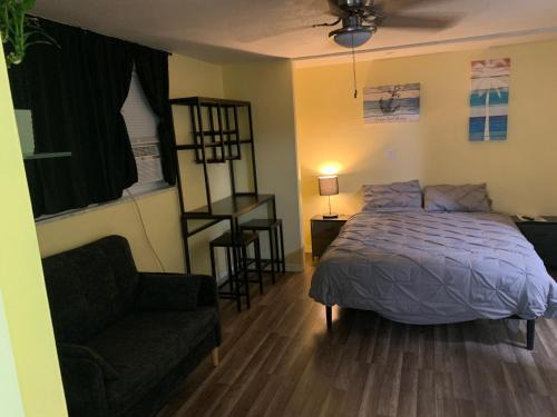 Pinellas Park Casa | Private suite with small kitchen private bathroom entrance porch and driveway