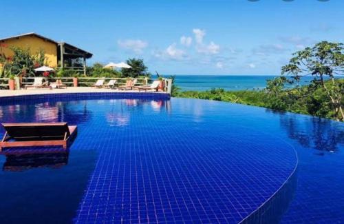 Pescaria Apartamento | Quarto e sala com piscina em Maceió - Villas Tulipa 02