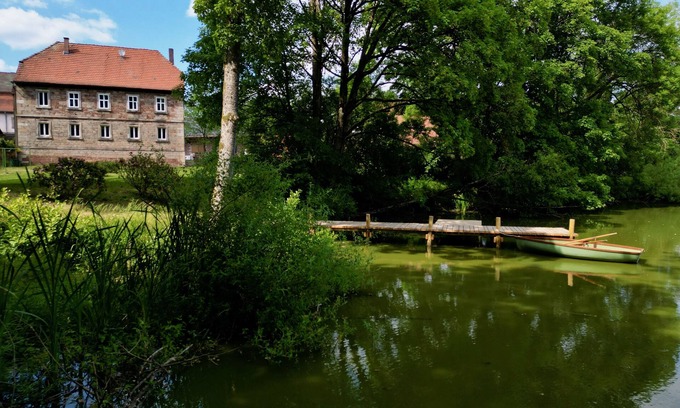 Zeitlofs Condominio | Quiet vacation apartment with wood-burning stove, sauna, garden & terrace on historic estate. Castle courtyard