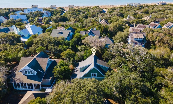 Cape Fear Station Casa | Reel Life tucked into a pretty, wooded bend in prestigious Cape Fear Station!