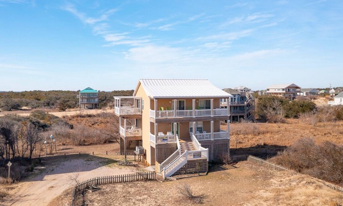 Corolla Casa | Relax among the dunes and see wild horses from the porch at Shifting Sands!